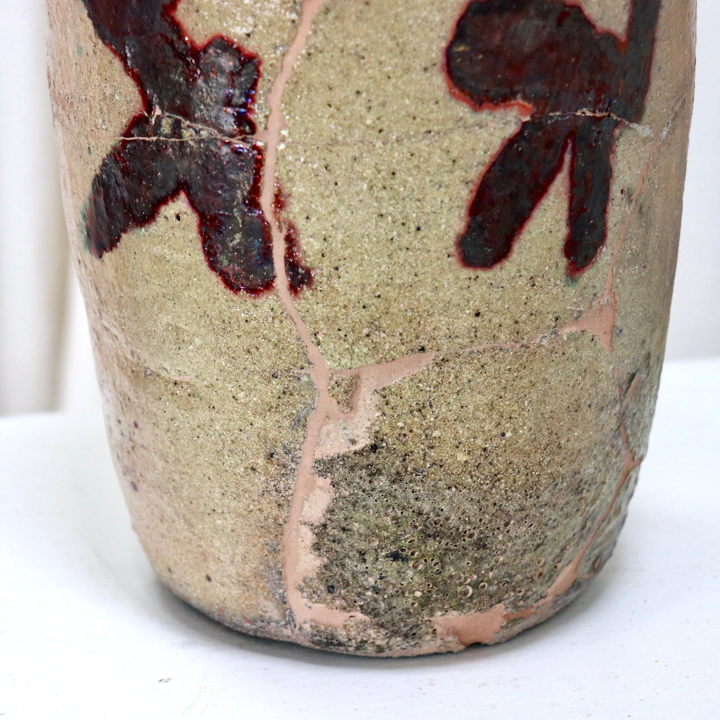 Restored antique ceramic with oxblood and green glaze