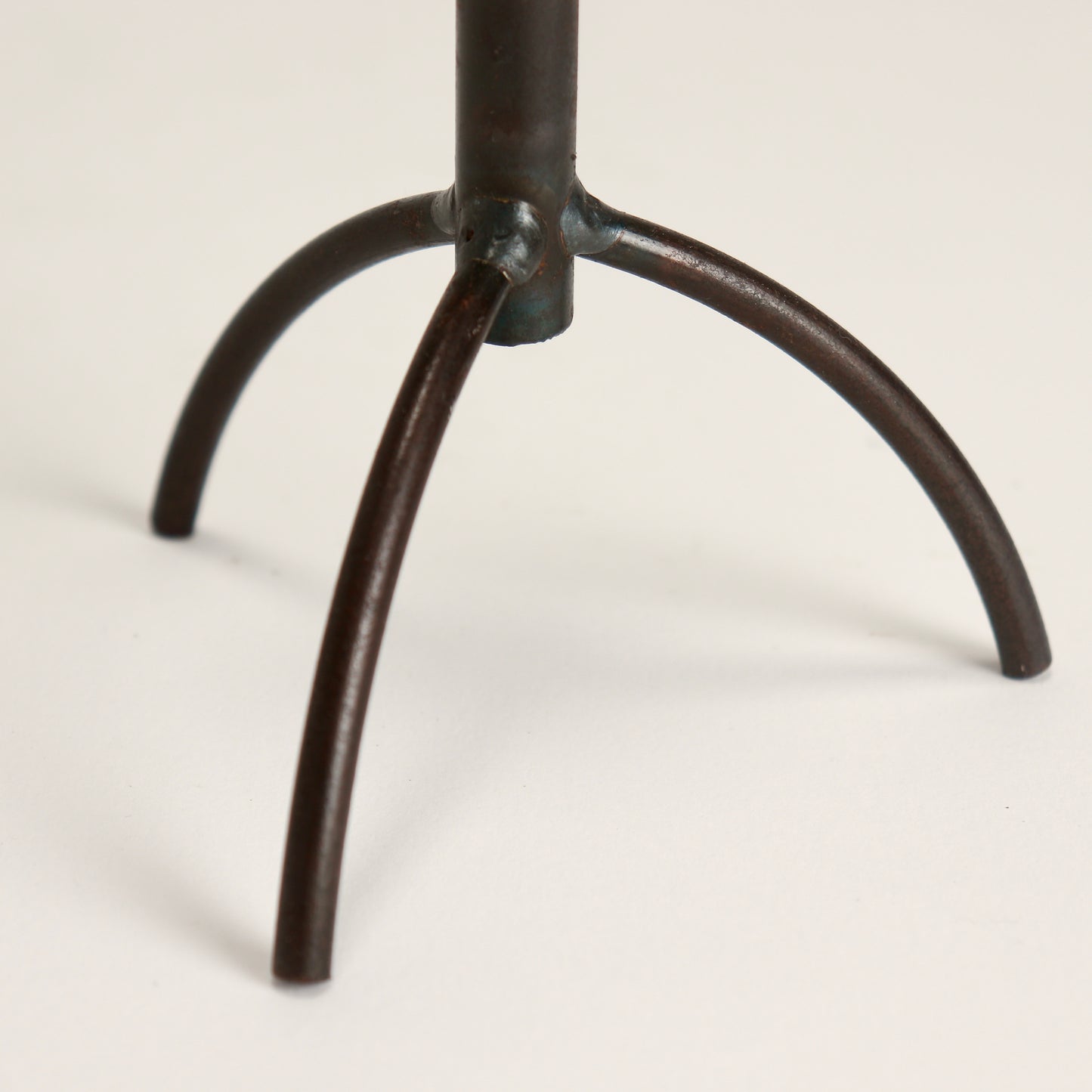 diminutive brutalist candle holder tripod legs