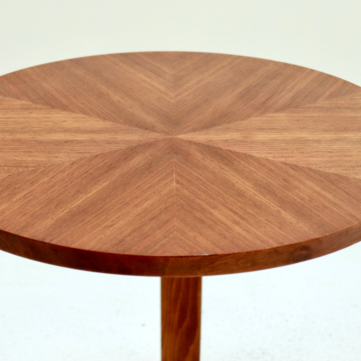 Close up of starburst veneer on vintage round table