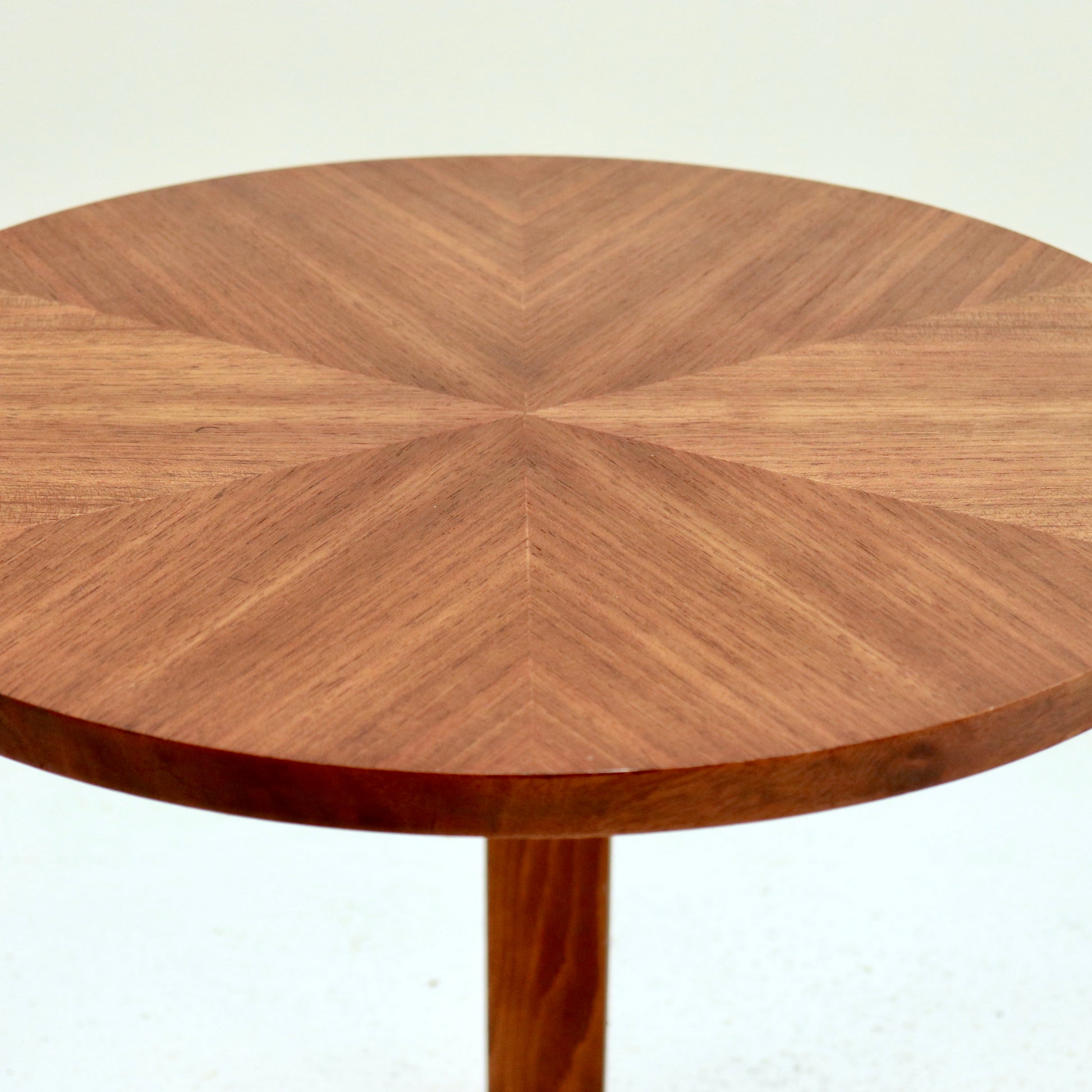 Close up of starburst veneer on vintage round table