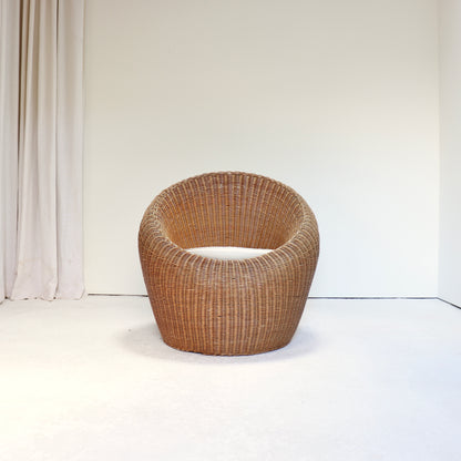 Vintage rattan lounge chair in the style of Isamu Kenmochi front view