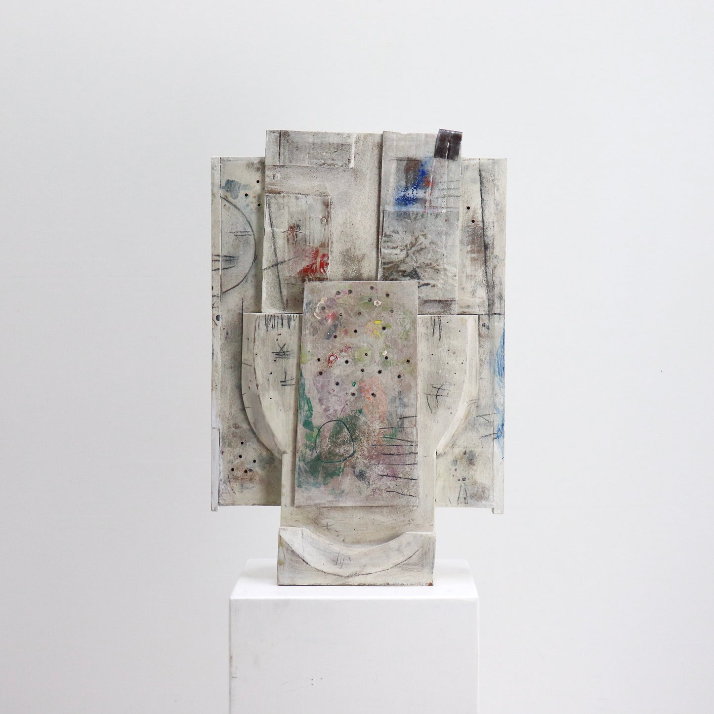 Mixed media relief artwork with carved wooden forms