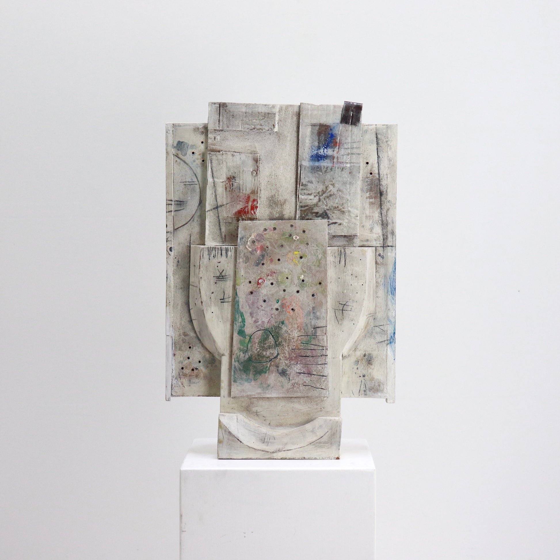 Mixed media relief artwork with carved wooden forms
