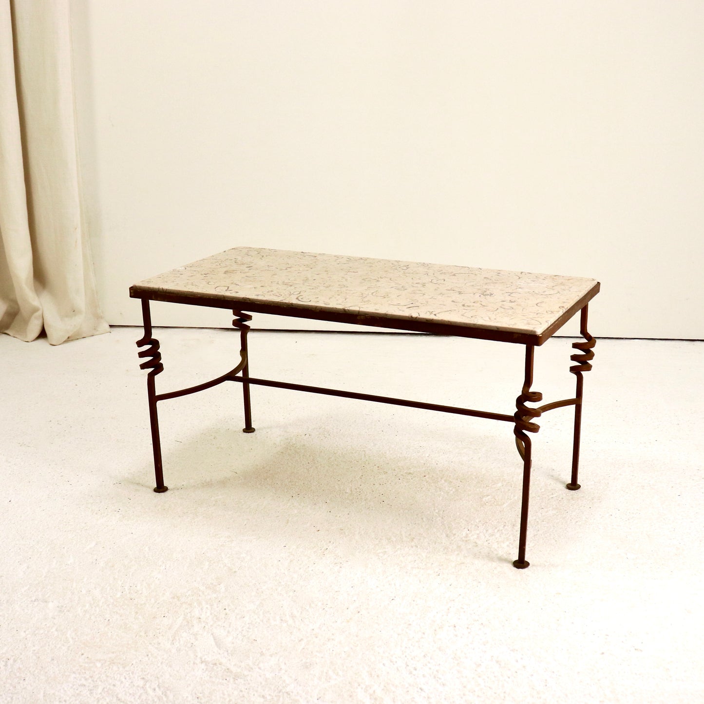 “Side view showing slim proportions of fossil stone table”