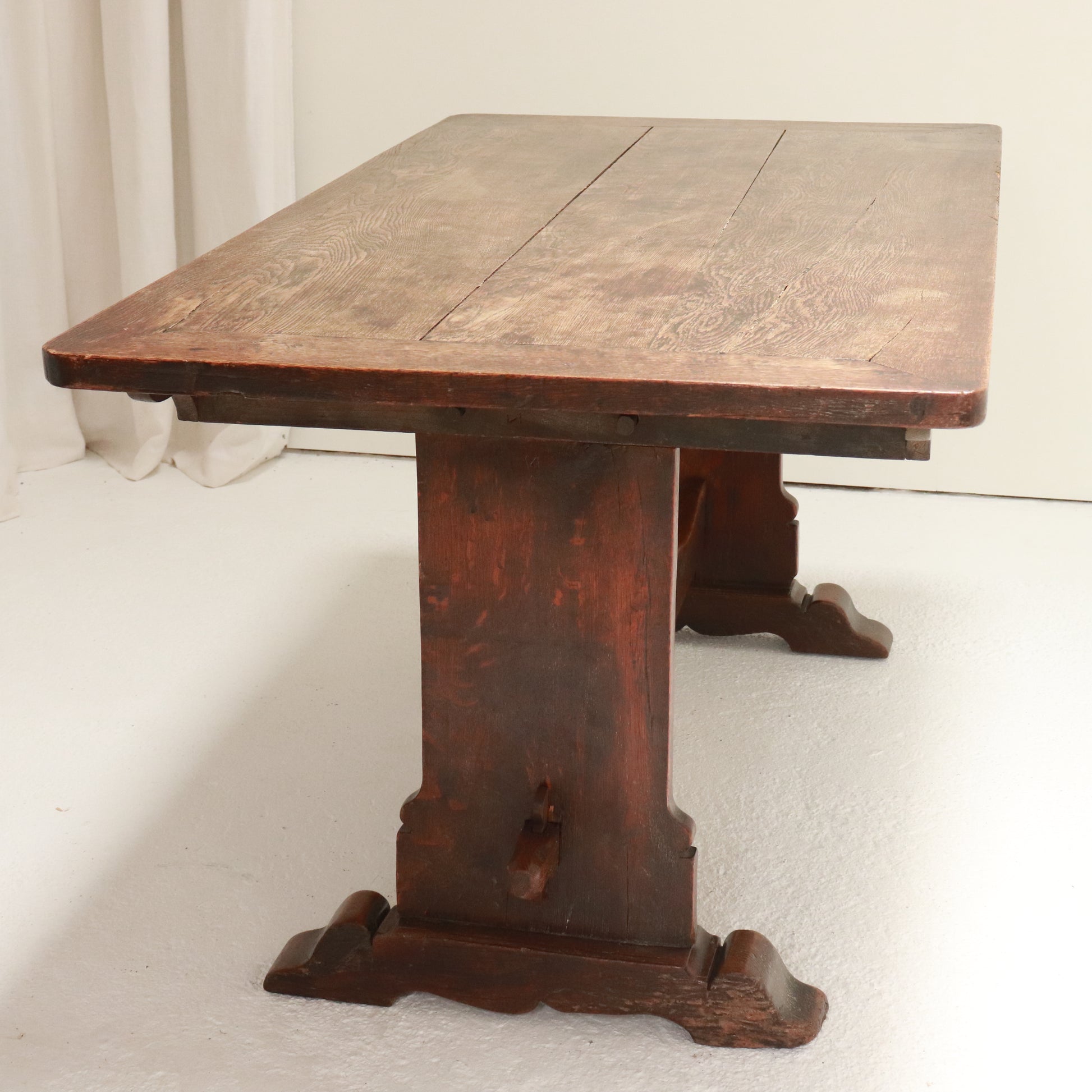 Overhead shot showing three-plank oak top with mitred cleated ends and rich patina.
