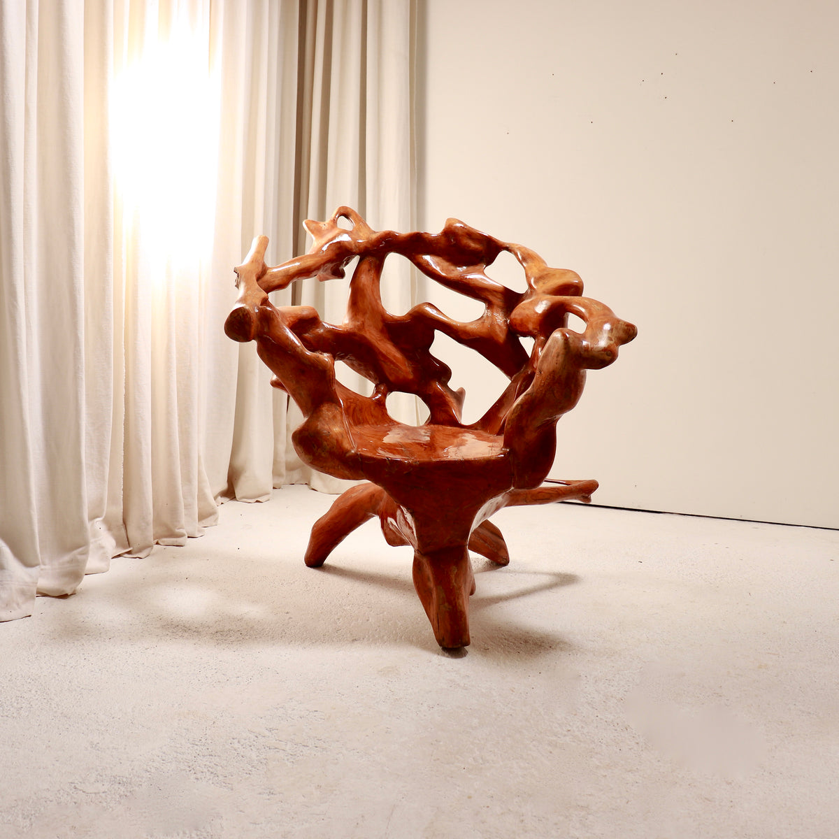 Vintage root wood armchair with organic openwork back
