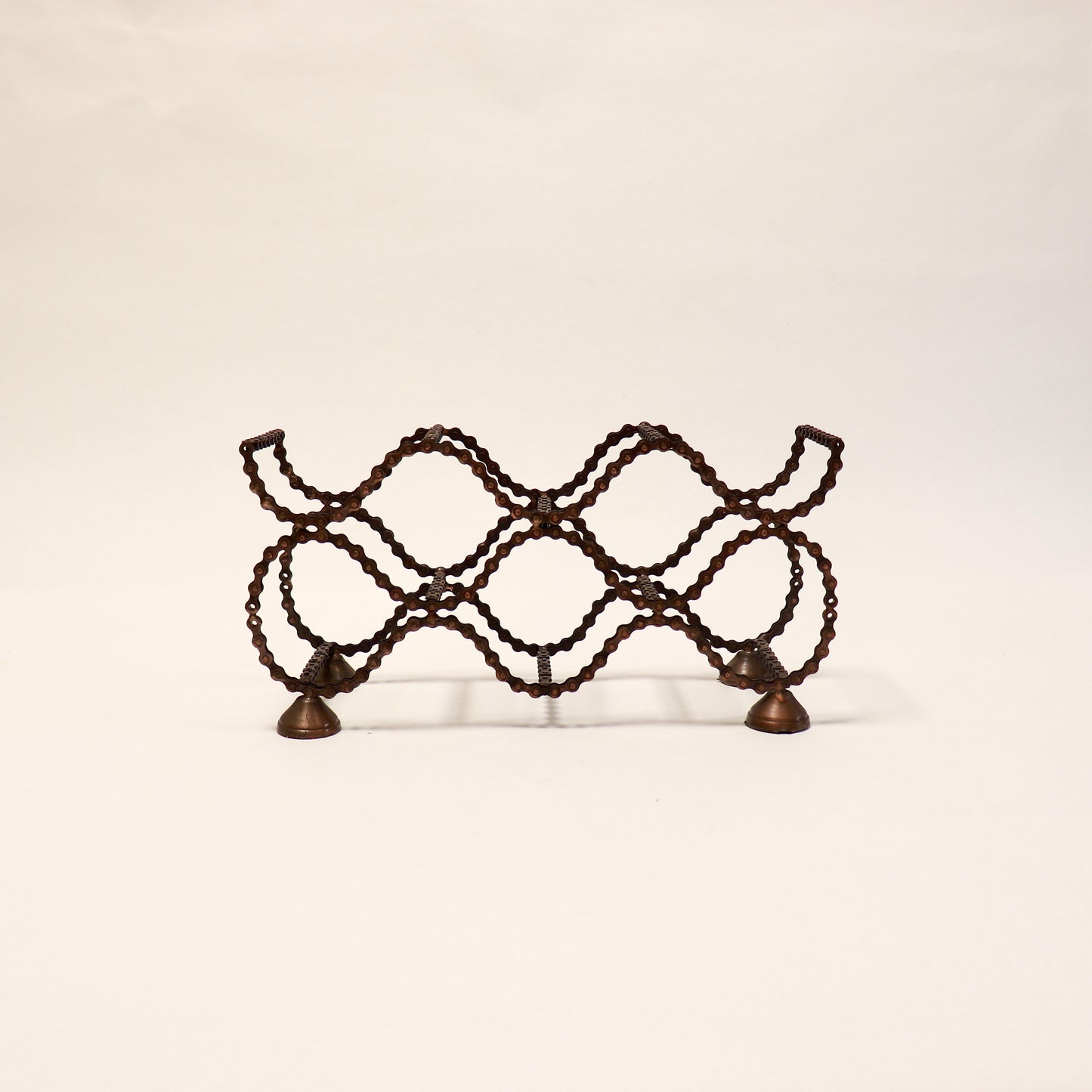 Vintage folk art bicycle chain wine rack with industrial character