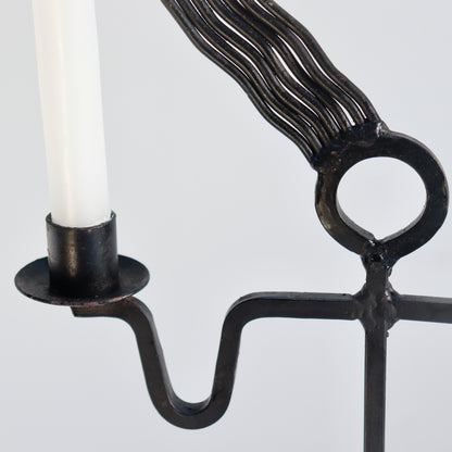 Blackened iron figural candle holder detail