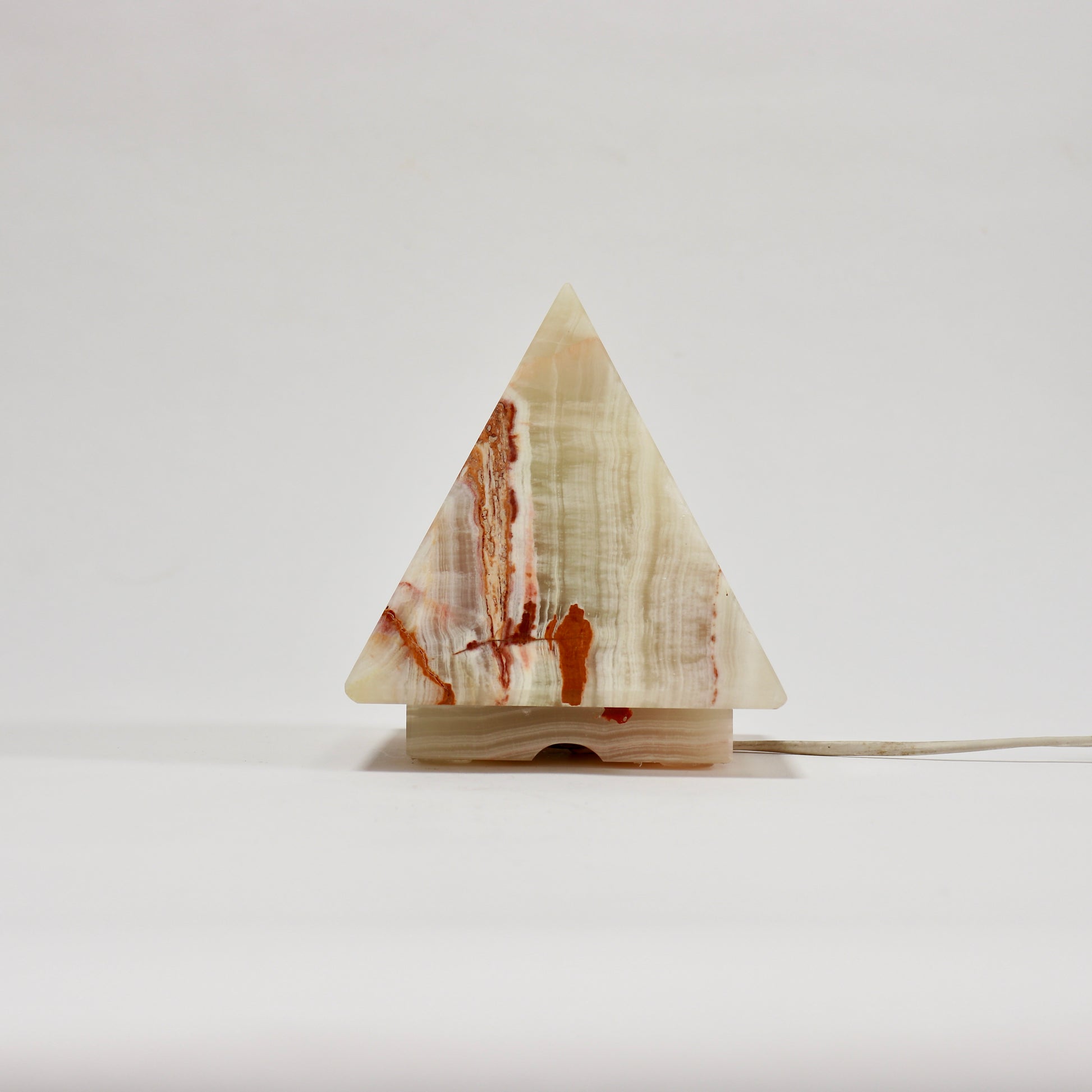 Decorative onyx lamp in geometric pyramid form