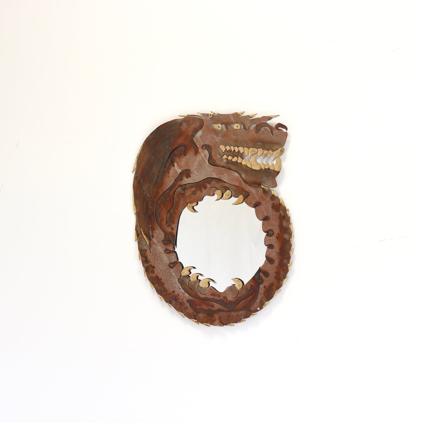 Torch-cut steel dragon mirror with brass teeth and claws