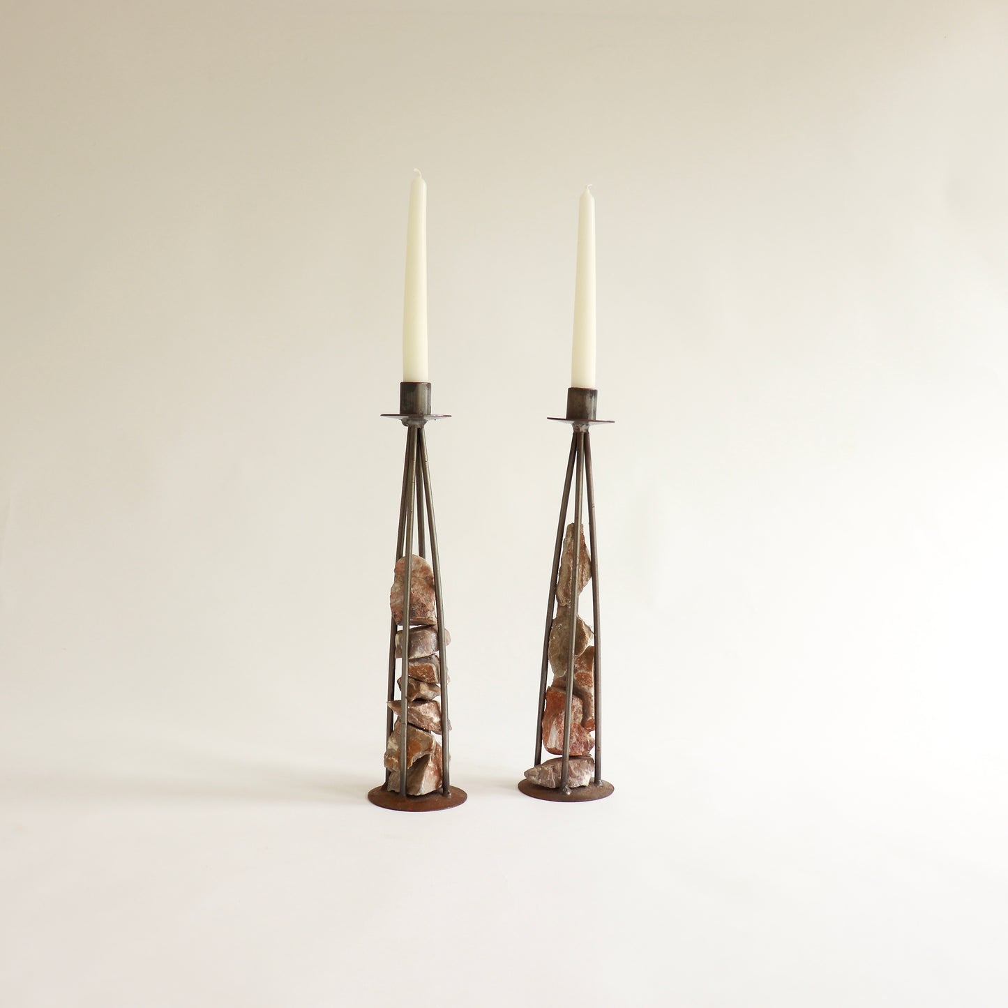 Brutalist steel candle holders with raw stone core