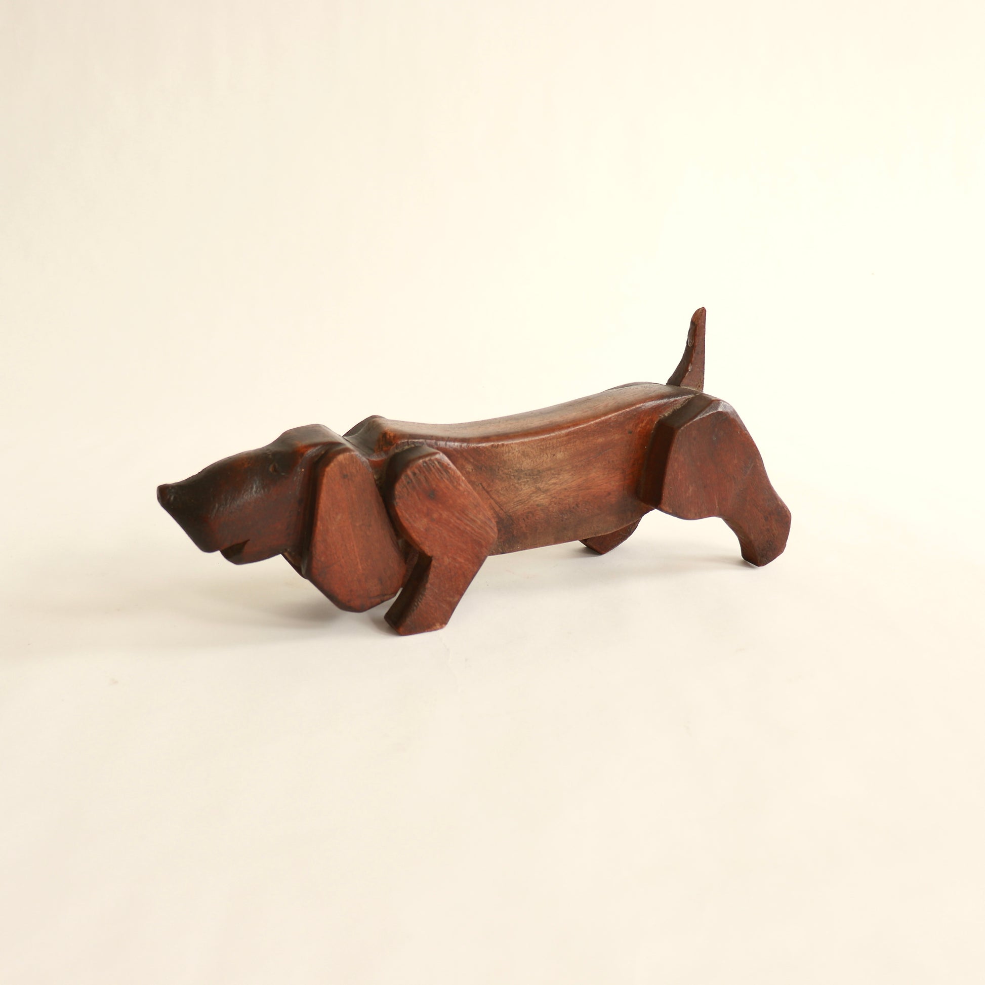 Mid century wooden dog carving elongated form
