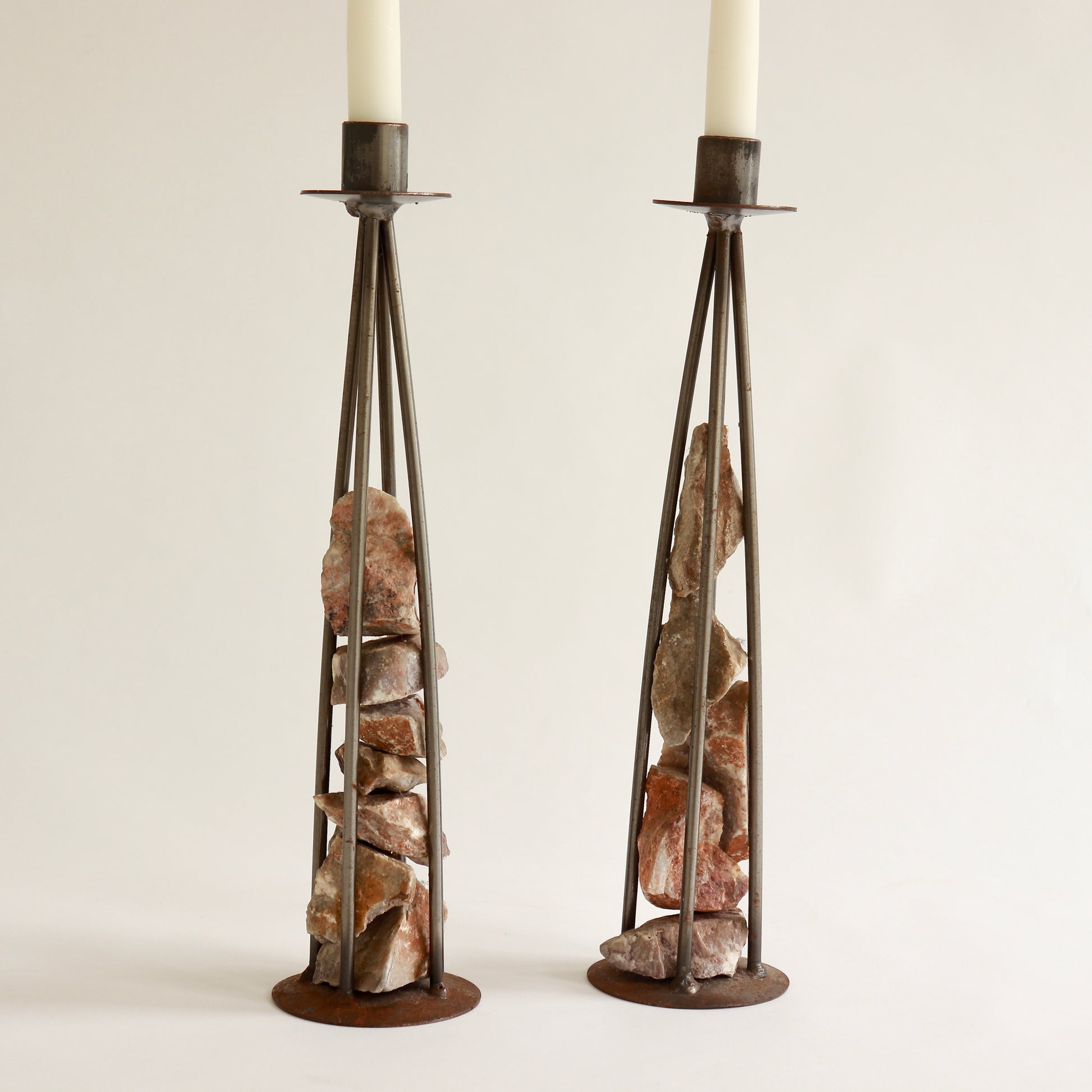 Pair of vintage stone and metal candle sticks
