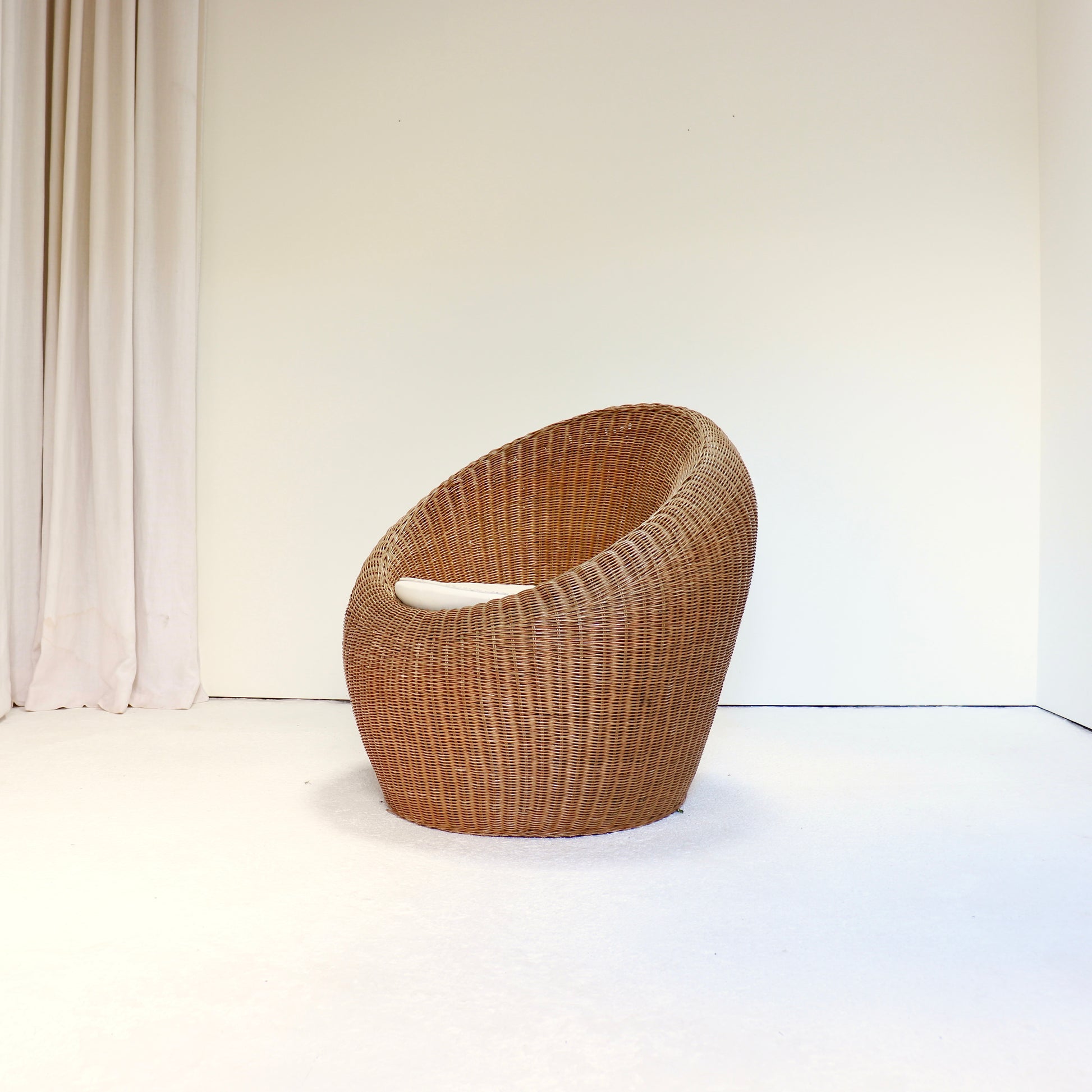Side profile of vintage rattan lounge chair bamboo frame