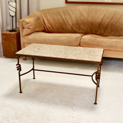 “Fossilised stone and wrought-iron coffee table, front view”