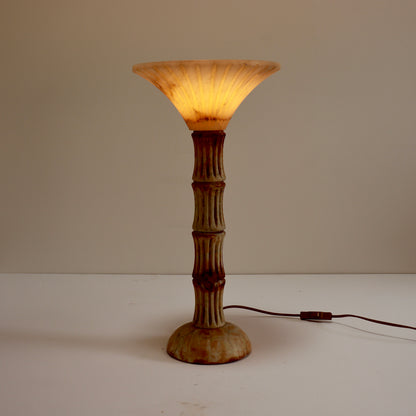 Illuminated alabaster uplighter showing natural veining.
