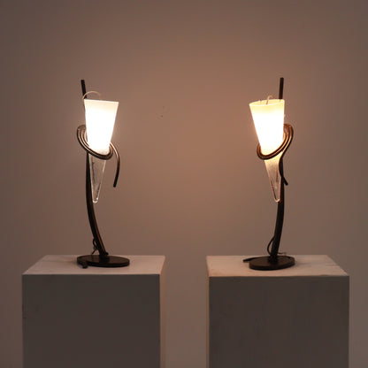 Lamps illuminated, warm ambient light through frosted cones.