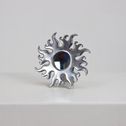 Petite cast aluminium sunburst mirror with flame rays front view