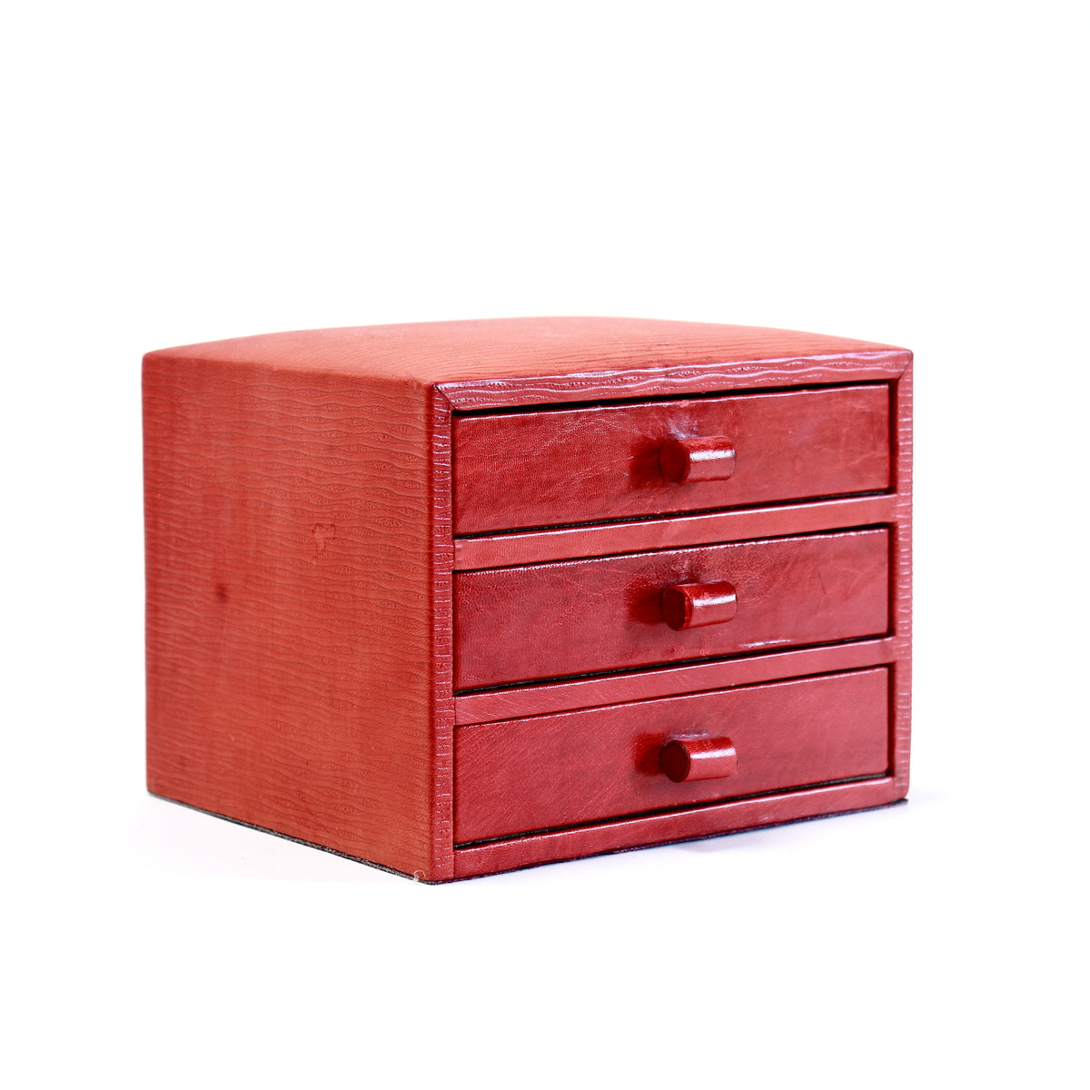 Angled view of the red leather jewellery box and its three drawer pulls