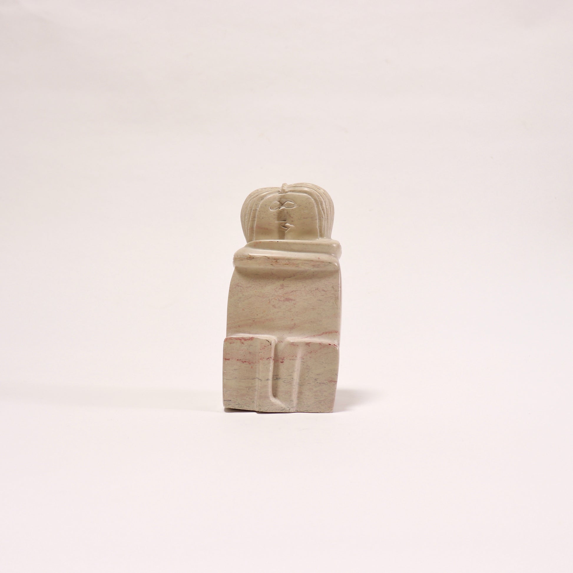 Soapstone sculpture after Brancusi's The Kiss front view