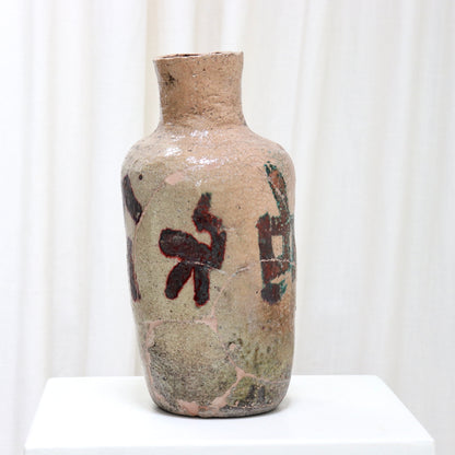 Wabi-sabi ceramic vase showing historic repairs