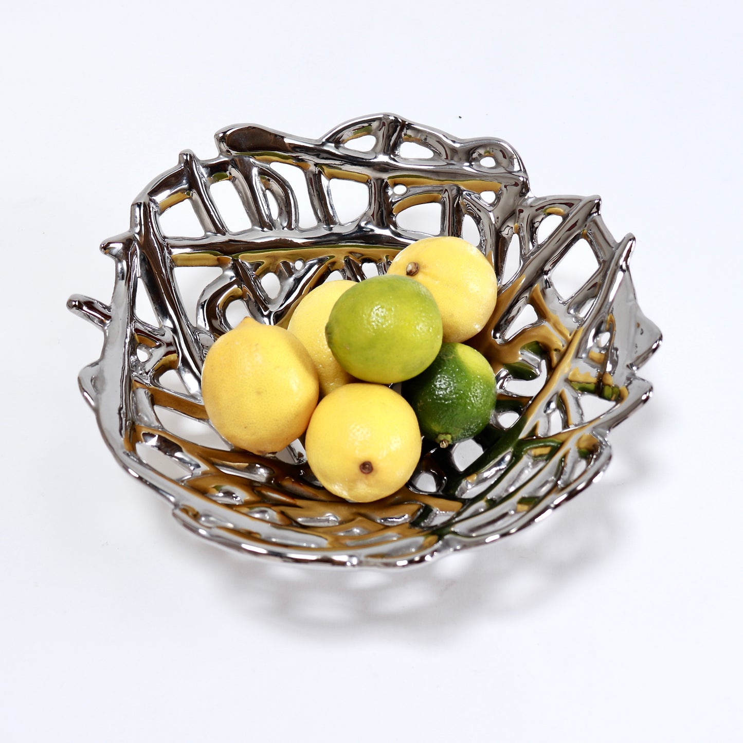 Contemporary silver ceramic bowl displayed with citrus fruit