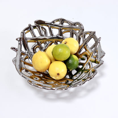 Contemporary silver ceramic bowl displayed with citrus fruit