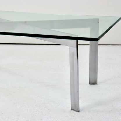 Side view of Barcelona-inspired glass and steel table
