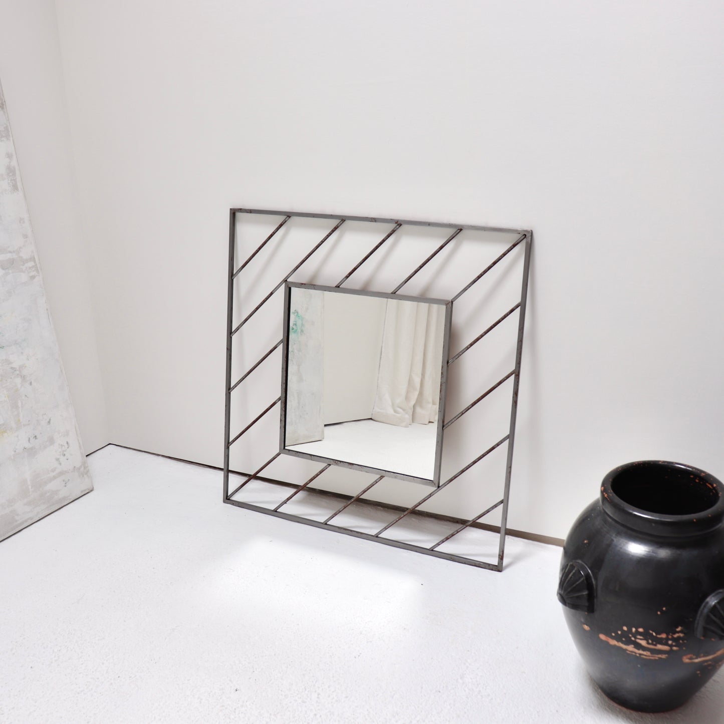 Postmodern steel mirror