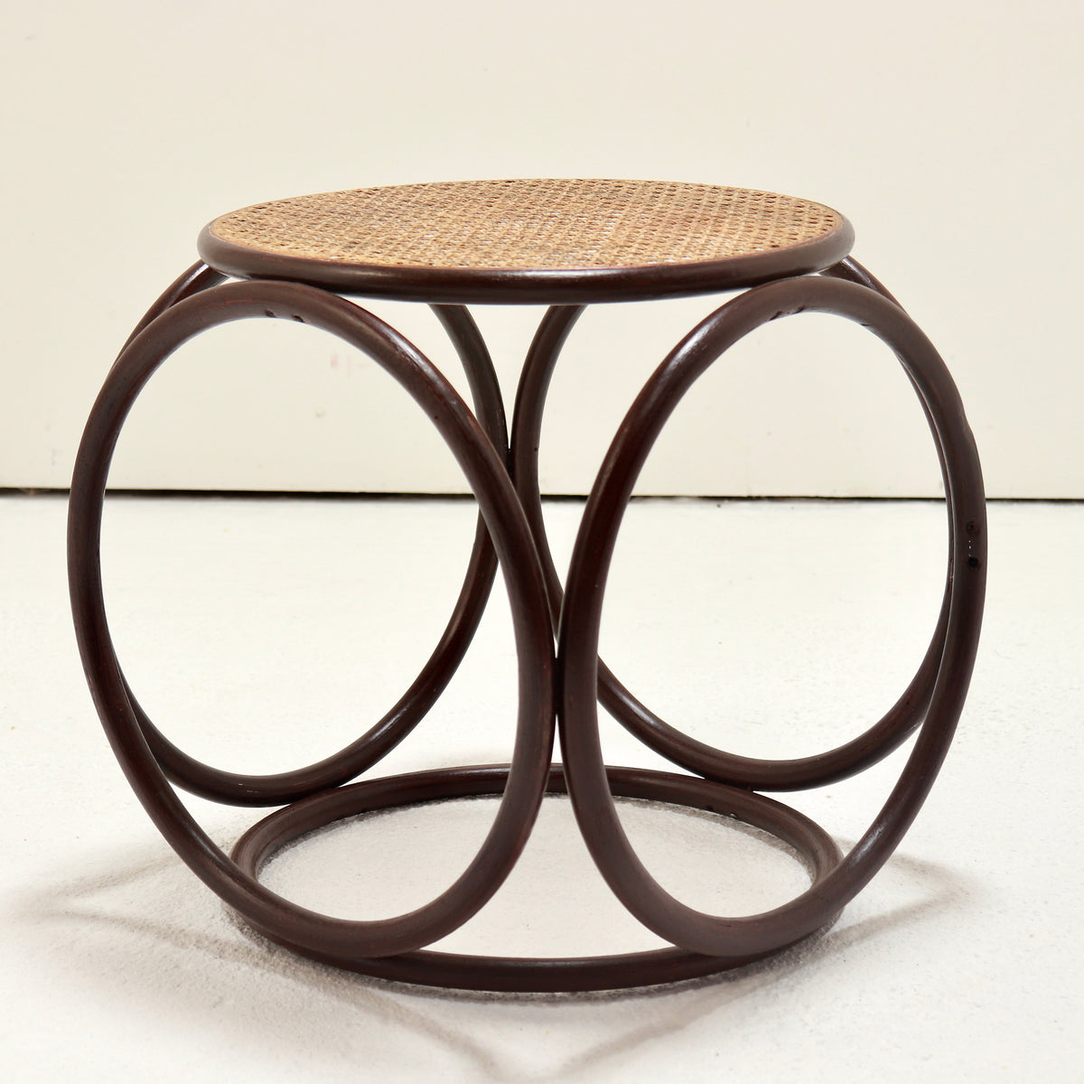 Side view showing the circular bentwood loops and round base
