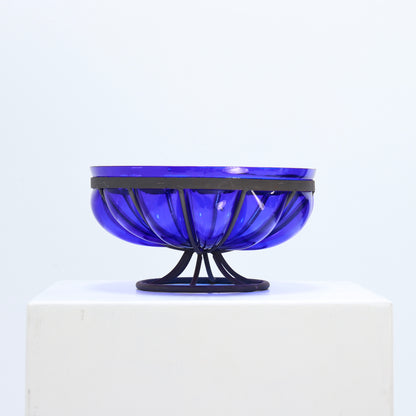 Cobalt blue glass bowl in ribbed metal stand