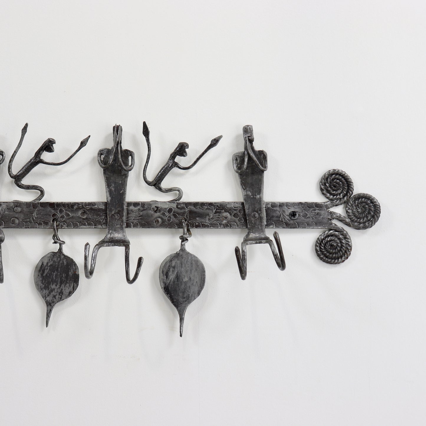 Wrought iron figural coat rack wall mounted