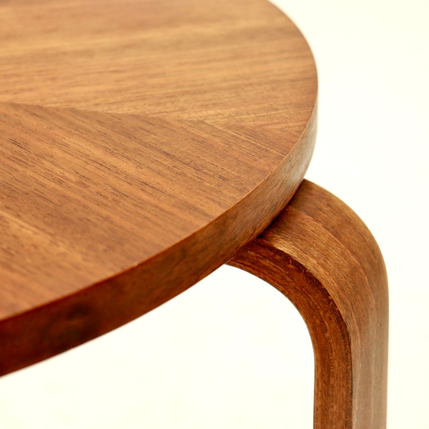 Detail of bent plywood leg meeting tabletop