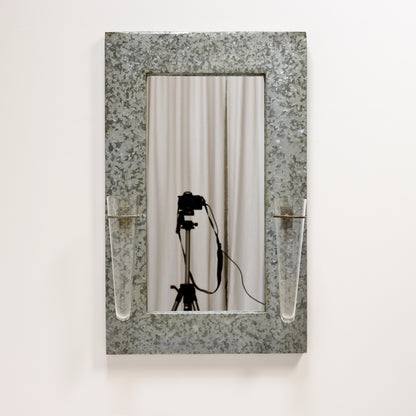Industrial galvanised mirror with floral tube vases
