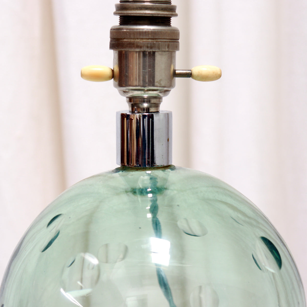 Detail of vintage double bone switch and nickel lamp holder
