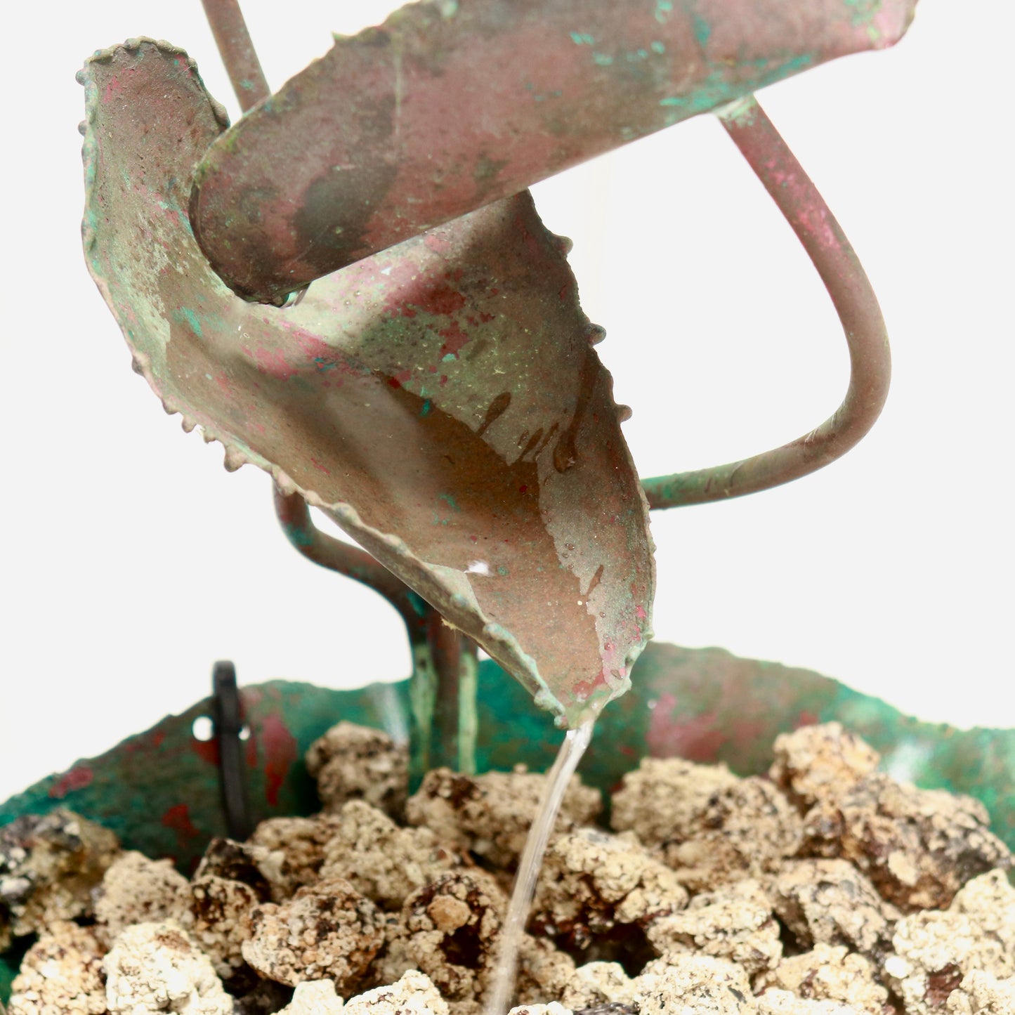 Basin stones catching the water as it returns.