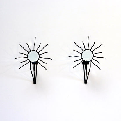 Sunburst wall sconces in the style of Andre Dubreuil