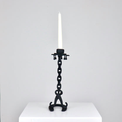 Sculptural workshop-made candlestick in patinated forged metal, H 31 cm
