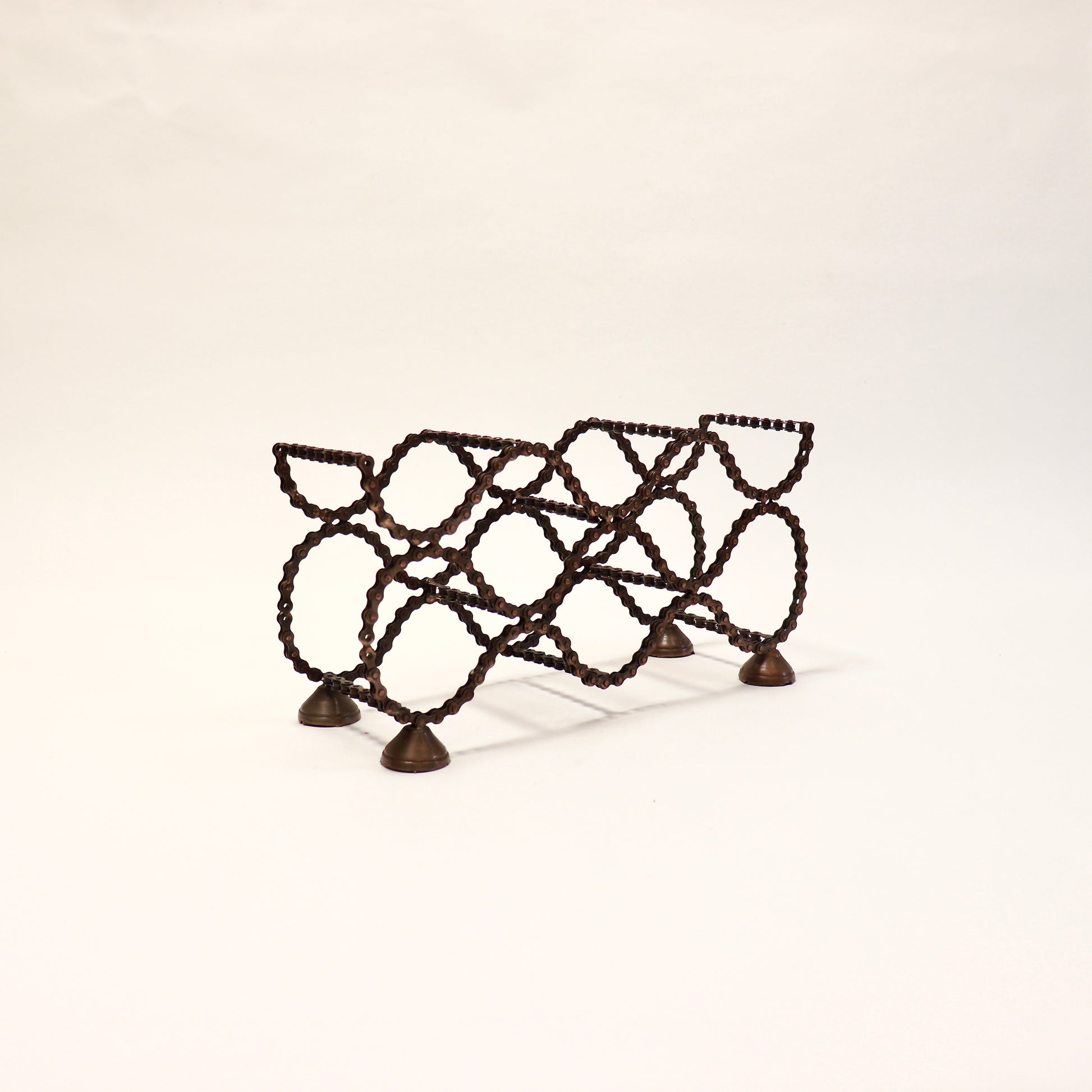 Sculptural wine rack made from recycled bike chain