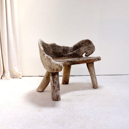 Alternative angle of the hand-carved primitive hardwood garden bench.
