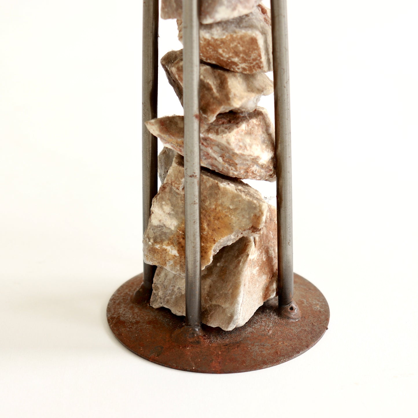Detail of oxidised steel and textured stone