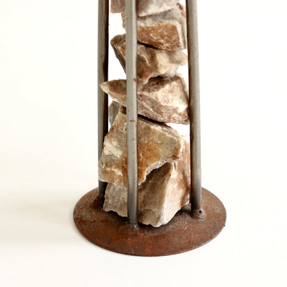 Detail of oxidised steel and textured stone