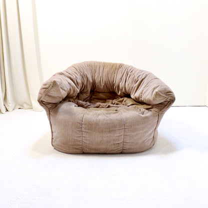 “Front view showing cocooning, low profile of Brigantin lounge chair.”