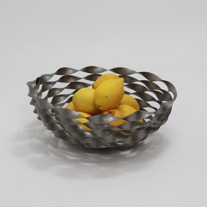 Vintage twisted steel bowl shown with lemons demonstrating scale