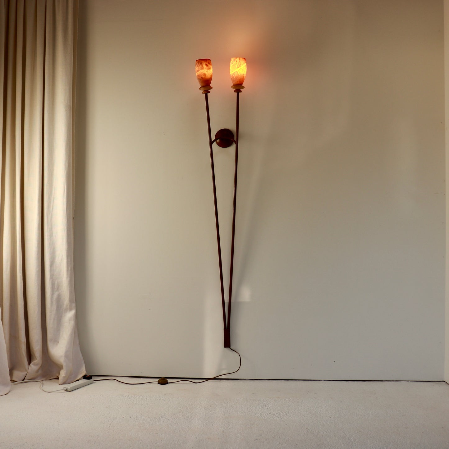 Illuminated alabaster wall light with warm amber glow