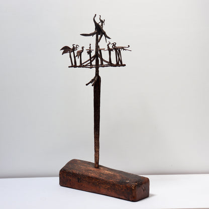 Vintage ritual iron sculpture mounted on wooden base