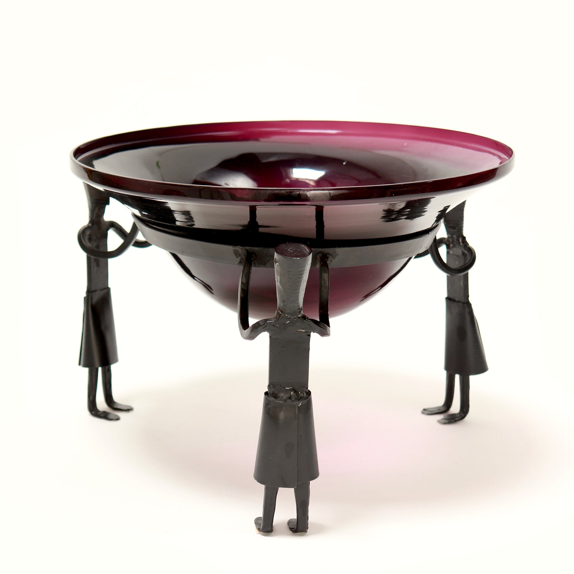 Purple glass fruit bowl on figural iron stand