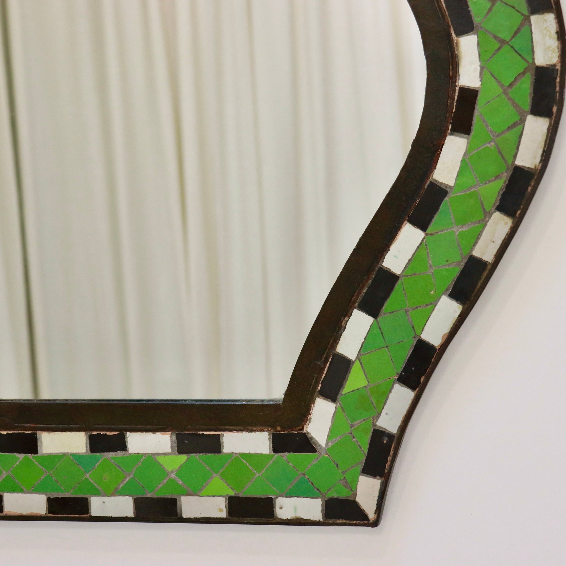 Side angle of Moorish mirror with iron edging