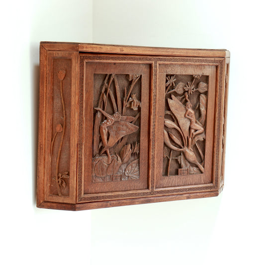 Hand carved wooden corner cupboard with fairy panels