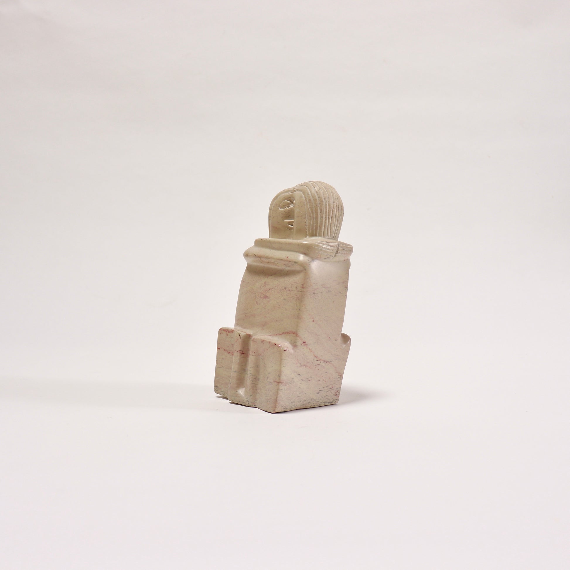 Vintage figurative soapstone sculpture with pink veining